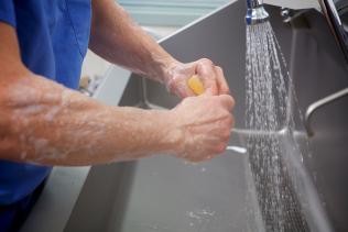 Photo of a surgeon washing his hands