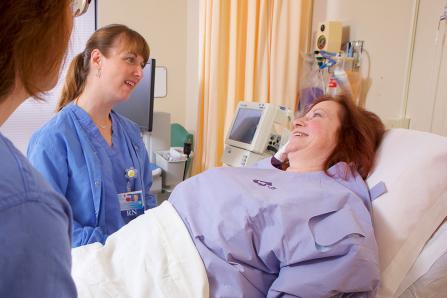 Nurses with an APD patient during her inpatient stay