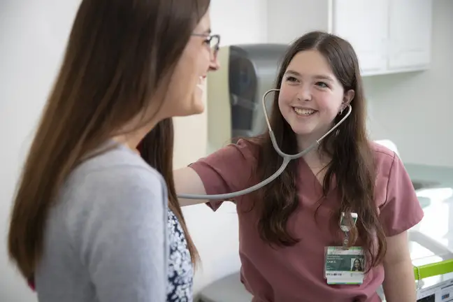 express care nurse listening to patients lung sounds