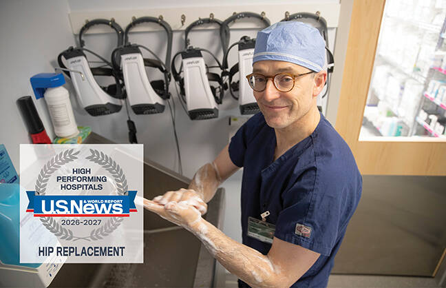 Male healthcare provider washing his hands prior to surgery
