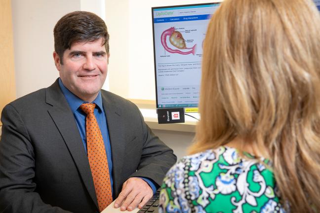 Dr. Michael Ritondo meets with a patient