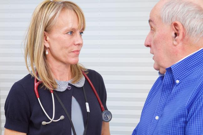 Photo of internal medicine team member and an APD patient